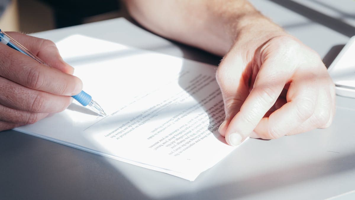 Will and estate planning document being signed